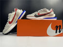 Sacai x Nike VaporWaffle "Sport Fuchsia Game Royal"